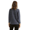 Back view of a model wearing a relaxed fit dolman sleeve top in Heather Indigo Haze, showing the ribbed knit texture and construction details against a white background.