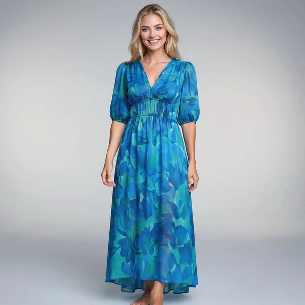 View of an elegant floral midi dress featuring a vibrant pattern, short sleeves, and a flowing silhouette