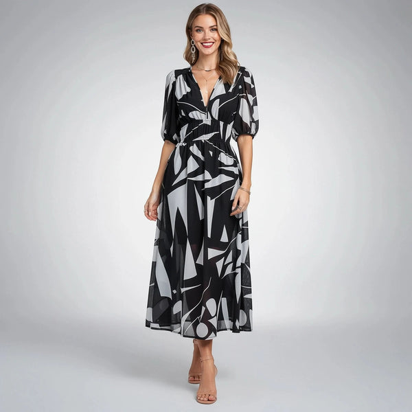 View of a floral midi dress featuring a soft fabric, elegant print in shades of pink and green, and a flattering silhouette