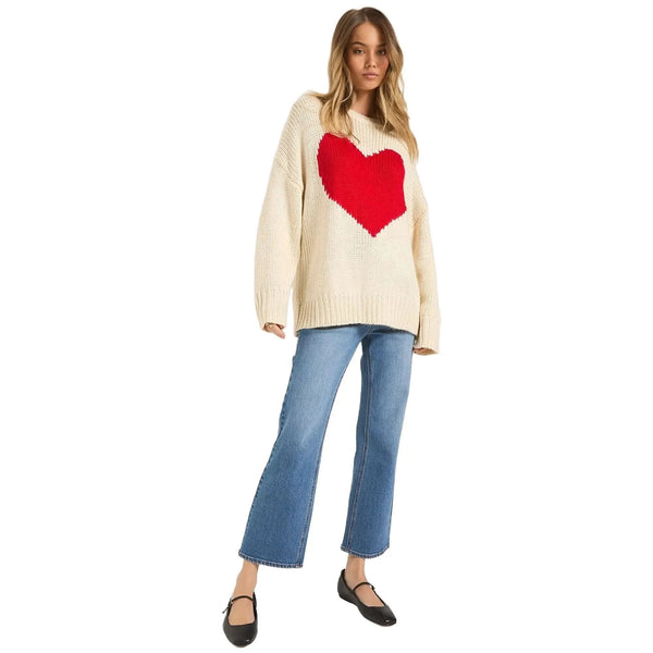 Detail view of a relaxed fit birch sweater featuring a heart graphic, displayed on a white background.