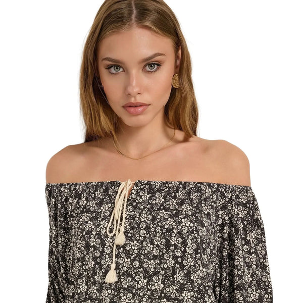 Close up view of the Ava Off Shoulder Cotton Floral Top showing intricate stitching and vibrant floral patterns on a soft cotton fabric.