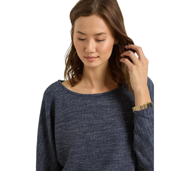 Close up view of the relaxed fit dolman sleeve top showing the soft ribbed knit fabric and detailed stitching in a neutral color against a minimalist background.