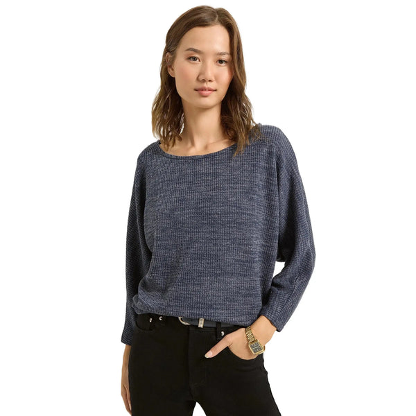 Close up view of the relaxed fit dolman sleeve top showing the soft ribbed fabric and detailed stitching in a neutral tone against a minimalist background.