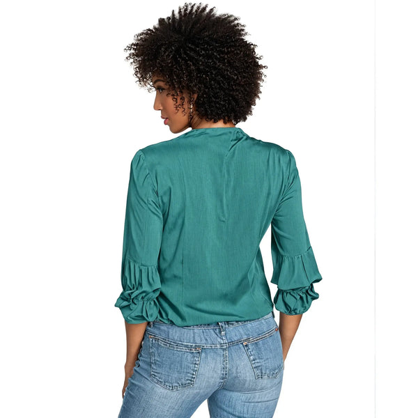 Back view of a model wearing a flowy v neck ruffle blouse in soft cream, showing the delicate ruffle details and lightweight fabric against a white background.