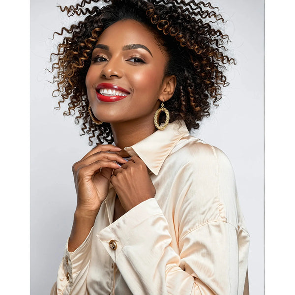 Model wearing Cream button down eyelet shirt with intricate detailing on white background.